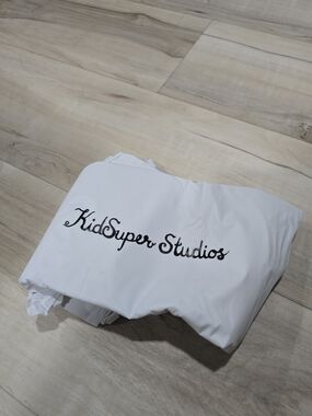 KidSuper Studios White Rain Poncho Black Printed Logo X White Poncho